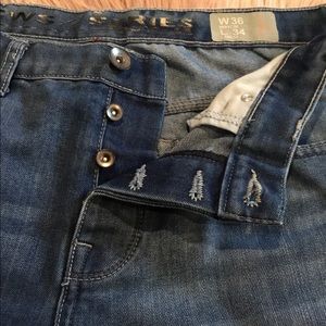 Men’s light wash button fly jeans